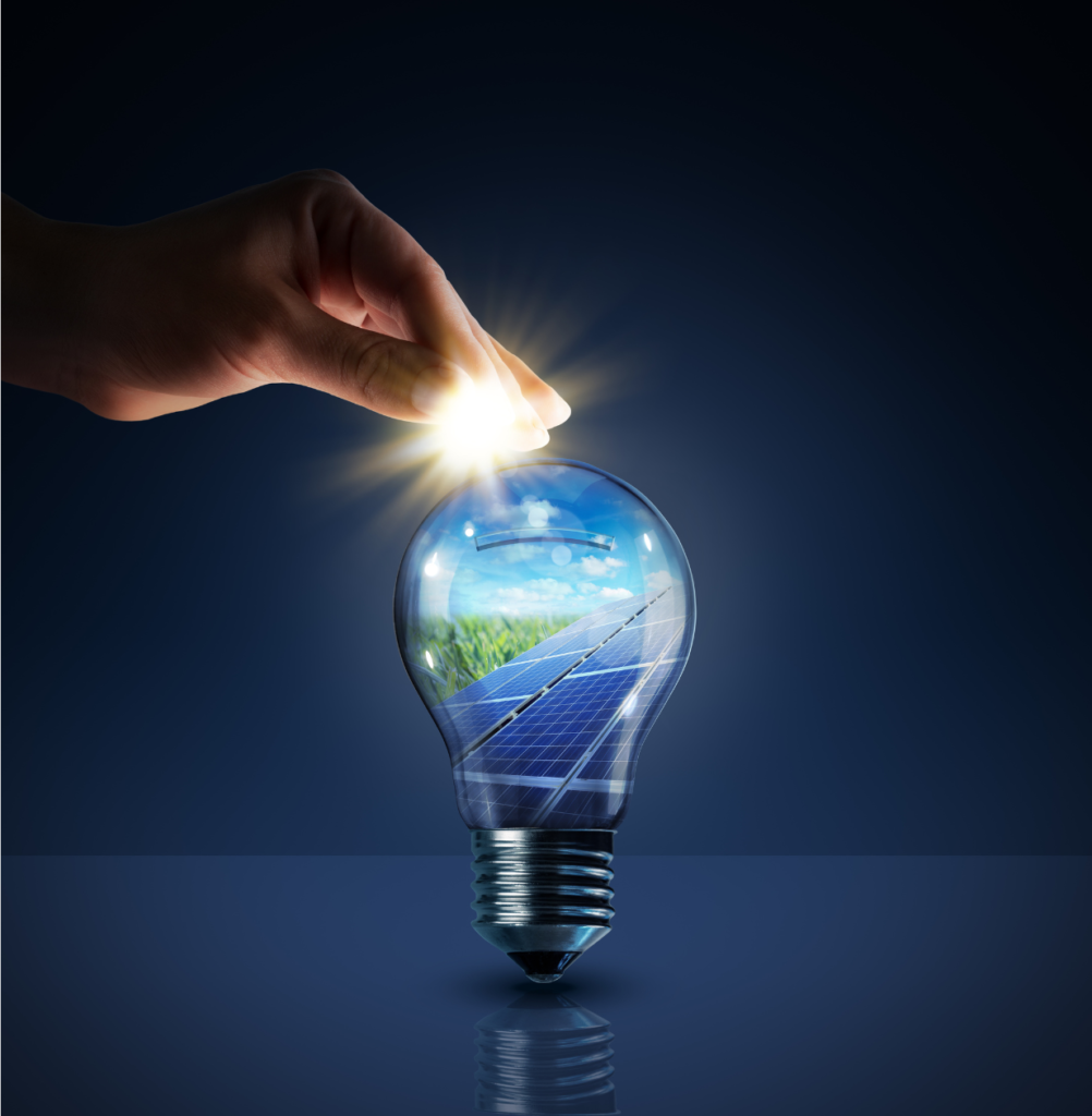 Top 5 Ways Commercial Solar Panels Benefit Business 18 A hand is showcasing the innovative integration of a light bulb with solar panels, exemplifying one of the top 5 ways commercial solar panels benefit business.